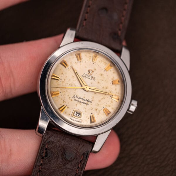 Vintage Omega Seamaster Calendar held in hand showing the scale of its 34.5mm stainless steel case