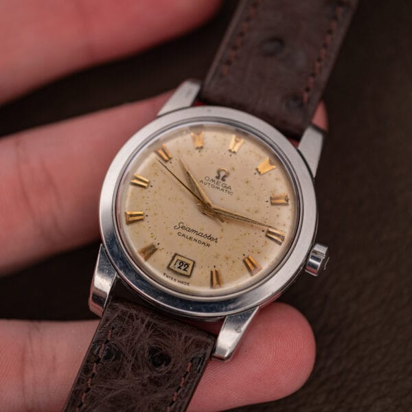Omega Seamaster Calendar 2757-2 SC in hand, freckled dial and gold dauphine hands in daylight