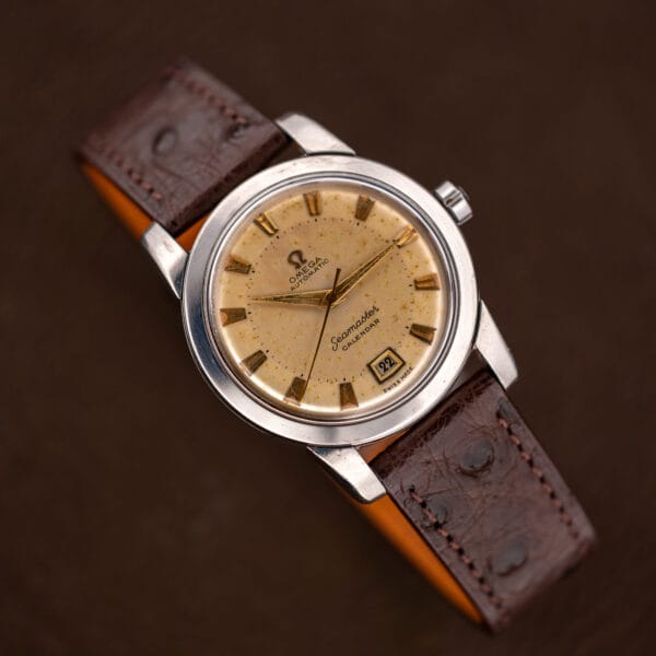 Vintage Omega Seamaster Calendar 2757-2 SC stainless steel watch with brown ostrich strap laid flat