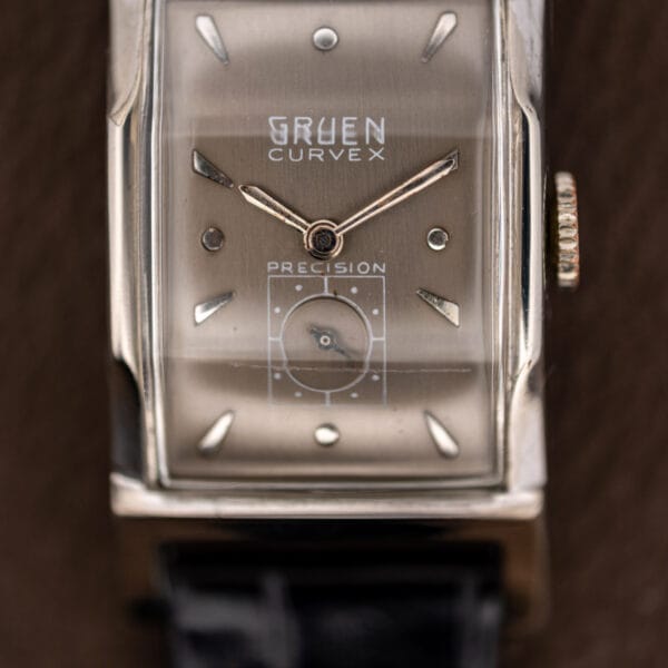 Gruen Curvex Precision dial macro showing stacked GRUEN CURVEX signature above the geometric framed subsidiary seconds register