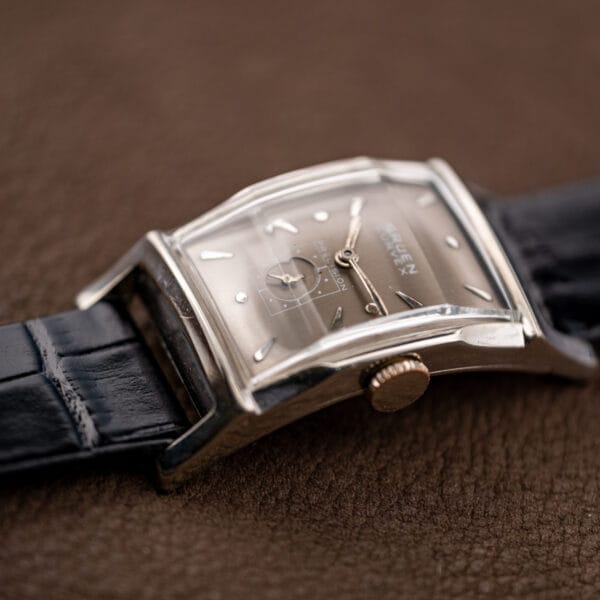 Gruen Curvex Precision 370-650 angled to show the case bend with the GRUEN CURVEX PRECISION dial text legible