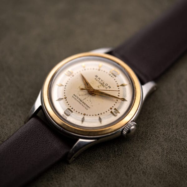 Baylor Automatic cal. AS 1361 viewed from above at an angle, gilt dauphine hands over an aged cream dial