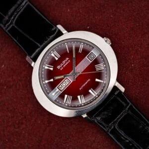 Bulova Day/Date T-3092 saucer case automatic, maroon vignette dial with day and date windows, black leather strap