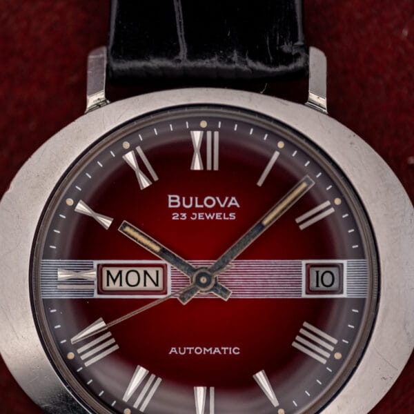 Bulova 23 Jewels automatic dial close-up, MON day aperture at nine and date at three on the band