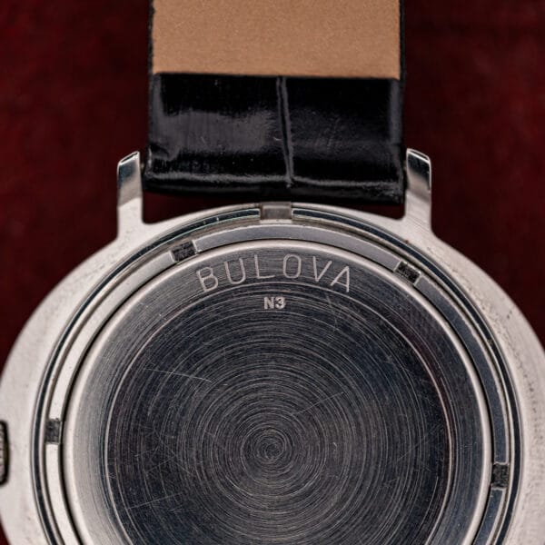 Bulova caseback macro showing the BULOVA signature over the N3 case date code for 1973