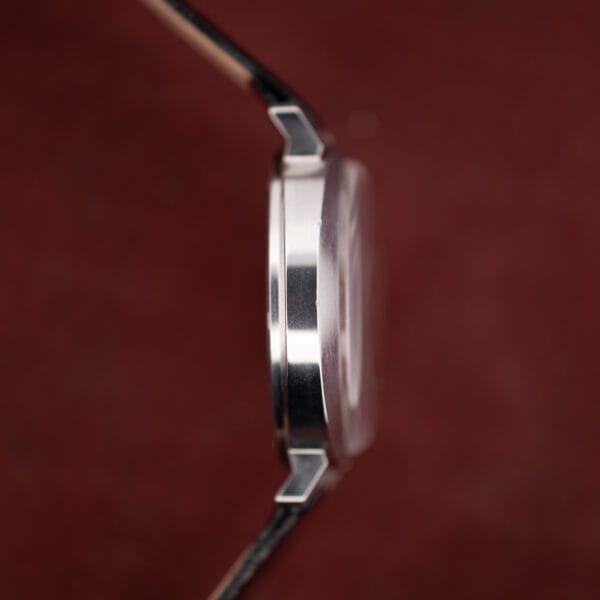 Bulova saucer case in profile, polished steel flank and the angled tips of the short lugs