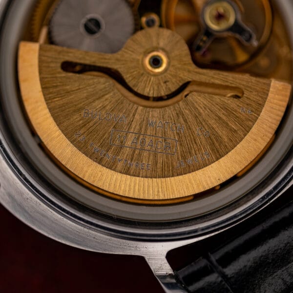Macro of the Bulova rotor engraved 11 AOACB and 23 TWENTYTHREE JEWELS, with the N4 plate code alongside