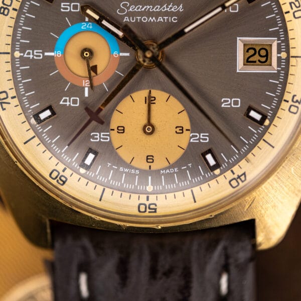 Omega 176.007 dial macro with the blue and salmon 24 hour register and champagne twelve hour totaliser