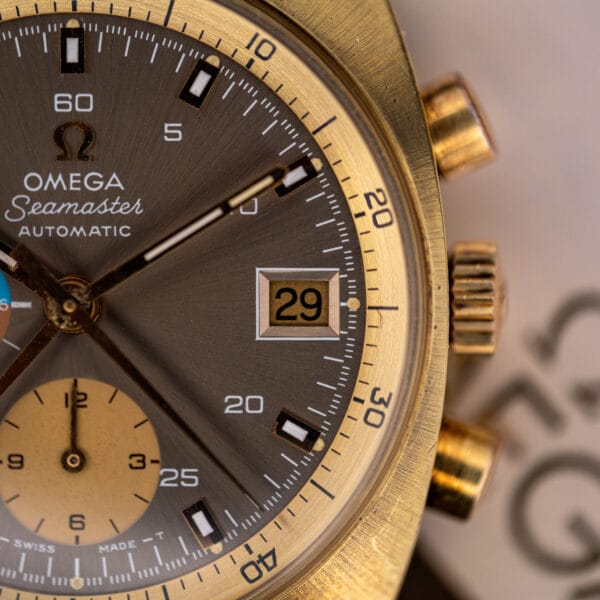 Fluted signed crown and twin chronograph pushers on the gold plated flank of the Omega Seamaster 176.007