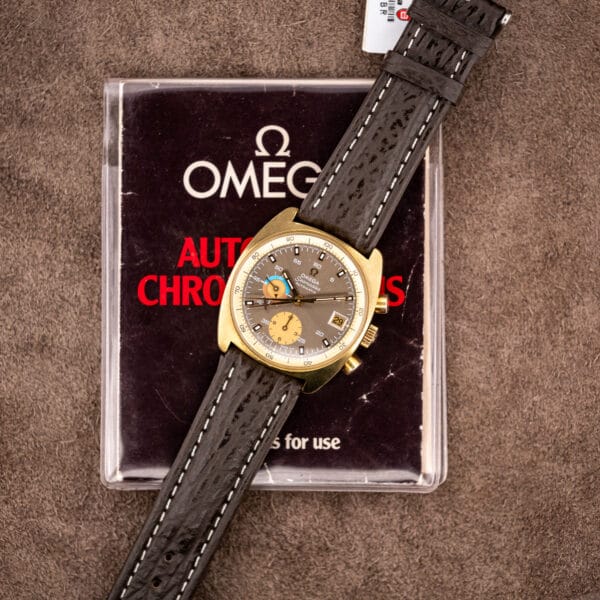 The 176.007 resting on Omega's original Automatic Chronographs instruction booklet, shark strap coiled alongside