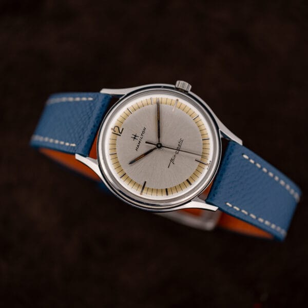 Vintage Hamilton Thin-O-Matic watch with fluted crown at three and faceted lume-filled hands over a two-tone dial