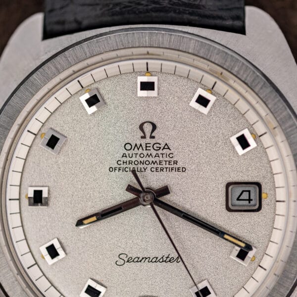 Omega Seamaster 168.035 dial macro showing sandblasted silver texture and chronometer printing