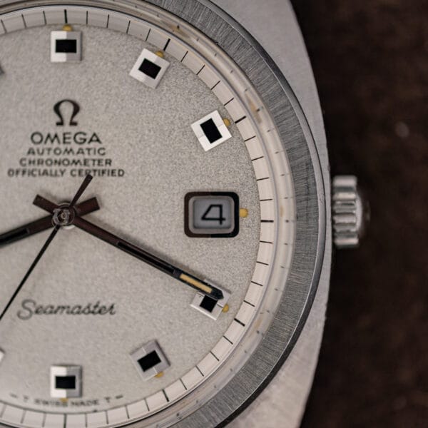 Omega Seamaster 168.035 crown-side close-up with signed Omega crown and framed date window