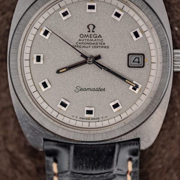 Omega Seamaster 168.035 dial close-up with black minute track, square markers, and aged luminous baton hands