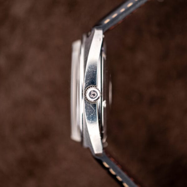 Omega Seamaster 168.035 side profile showing domed crystal and signed crown