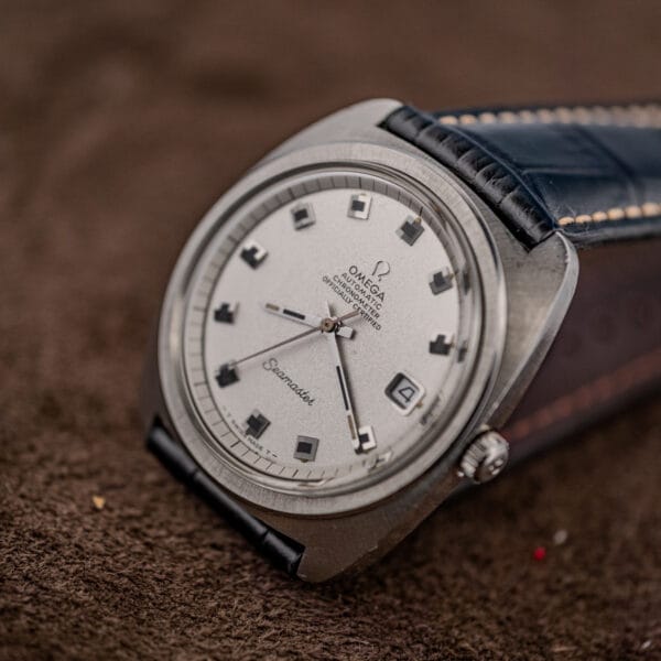 Omega Seamaster 168.035 three-quarter view of the silver textured dial and brushed cushion case