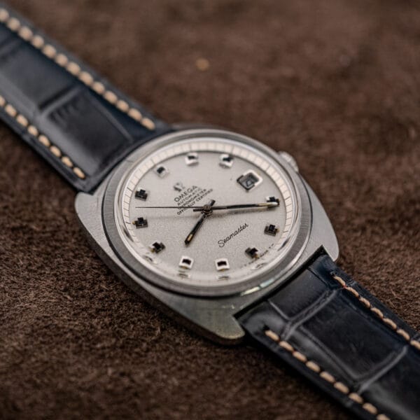 Omega Jumbo Seamaster 168.035 low angle showing sloped crystal edge and broad brushed case top