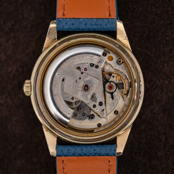 The automatic movement with its rotor engraved Movado Factories and twenty eight jewels