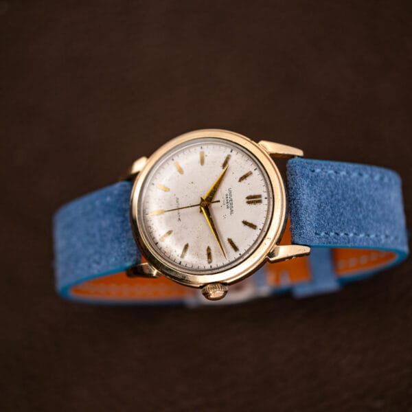 Tan leather lining visible beneath the powder blue Italian suede of the fitted strap