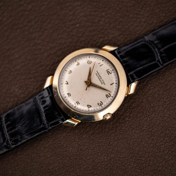 Hamilton K-455 at an angle showing the domed 10k gold filled bezel and flared fancy lugs