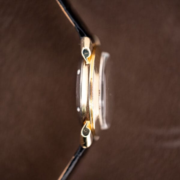 Profile view of the 10k gold filled bezel and stainless steel caseback on the Hamilton K-455