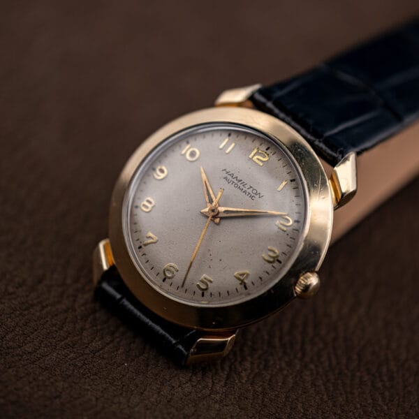 Hamilton K-455 vintage automatic wristwatch shown from the side on a black alligator strap