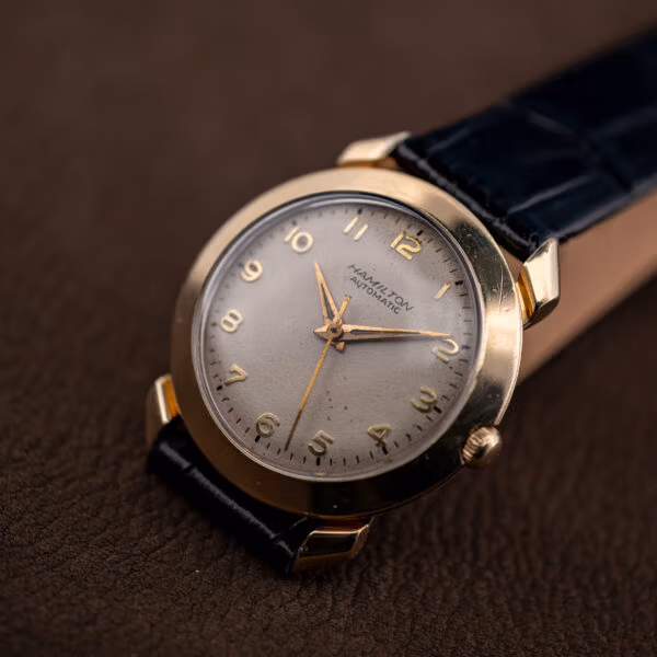 Hamilton K-455 vintage automatic wristwatch shown from the side on a black alligator strap