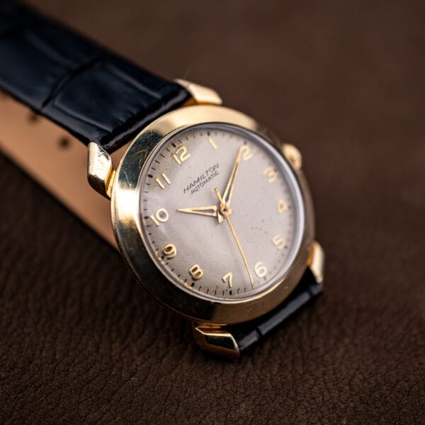 Angled view of the Hamilton K-455 showing honest wear across the gold filled case