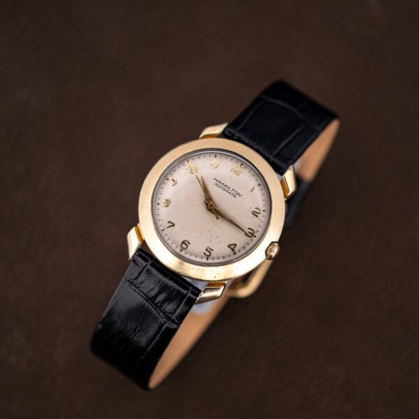 Top-down view of the Hamilton K-455 dial with applied gold numerals at every hour