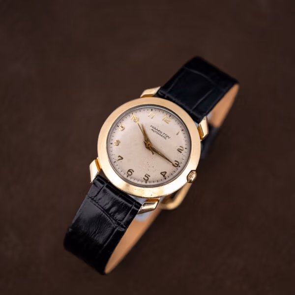 Top-down view of the Hamilton K-455 dial with applied gold numerals at every hour