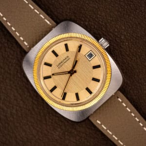 Longines Electronic 1522-1 with champagne dial and gold fluted bezel on taupe leather strap