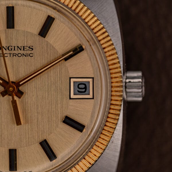 Champagne dial of the Longines Electronic showing applied gold batons and date window at three