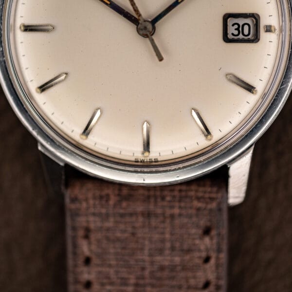 Lower dial macro showing the SWISS signature at 6 o'clock