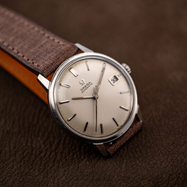 Omega Seamaster 166.002 dial at an angle showing applied markers and SWISS signature