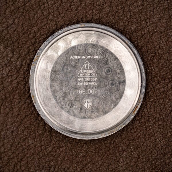 Inside the caseback stamped 166.002, ACIER INOXYDABLE and FAB. SUISSE