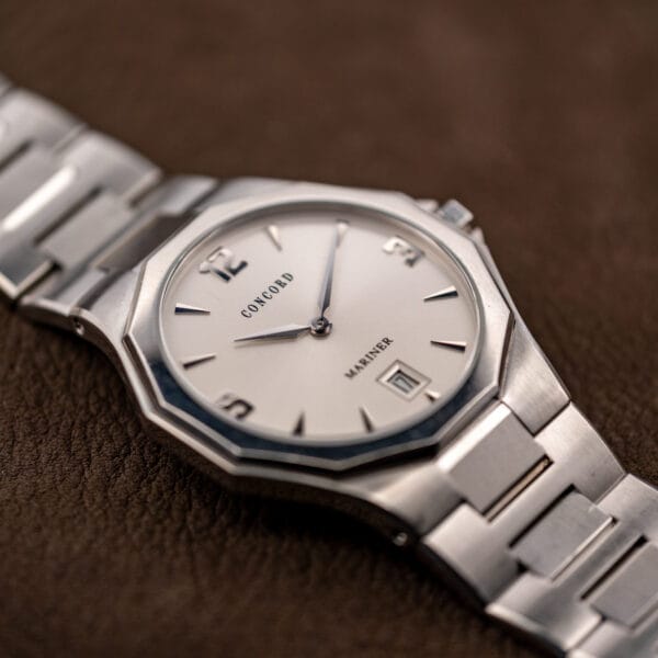 Low side angle across the crystal, showing how slim the case sits between bezel and bracelet