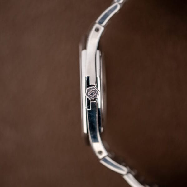 Macro of the hexagonal crown engraved with the Concord C, set into the case shoulder