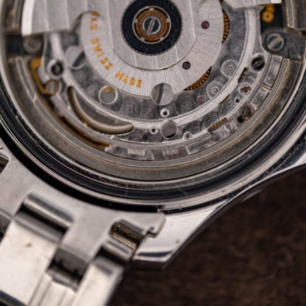 Rotor rim engraved SEVENTEEN 17 J and Swiss Made, with the caliber 1400 marking stamped on the bridge below.