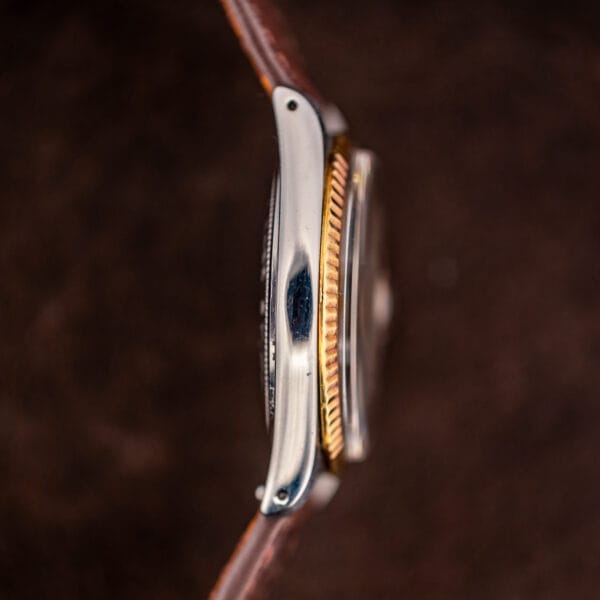 Tudor Prince Oysterdate side profile showing the polished steel mid-case and acrylic crystal