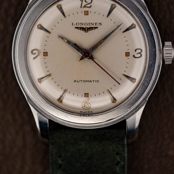 Longines Sei Tacche automatic dial with dagger markers, SWISS printing below six and fine fluted crown at three