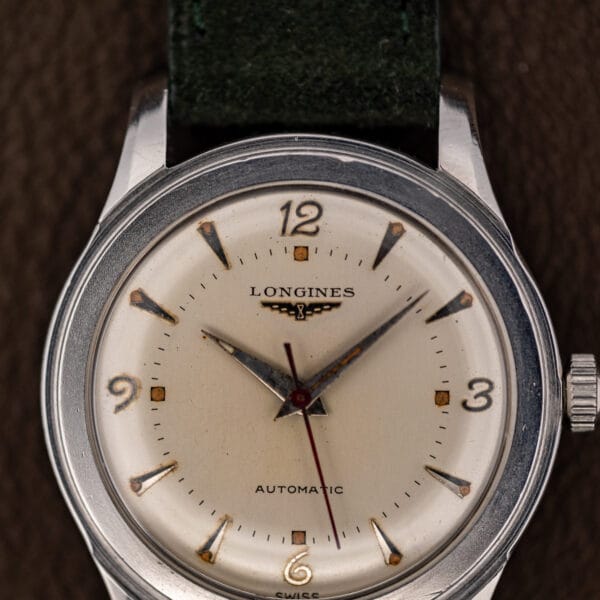 Vintage Longines 22AS dial layout, applied daggers at eight hours and square lume plots at the quarters