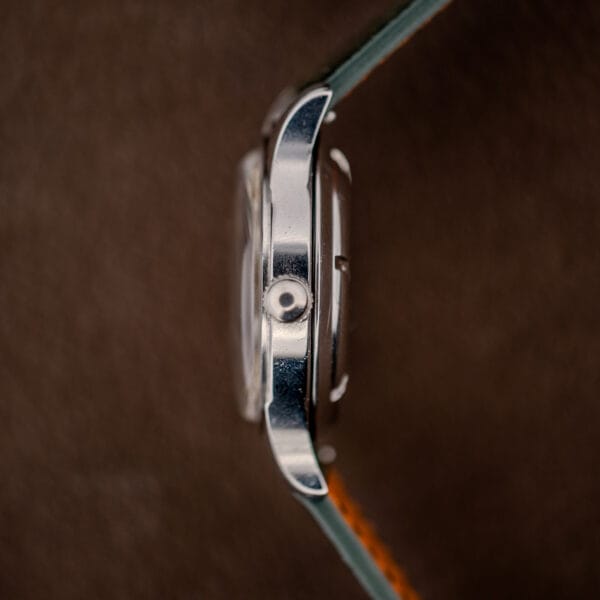 Longines Sei Tacche case profile from three o'clock with small fluted crown and slim polished mid-case