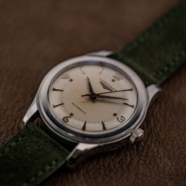 Longines automatic 6280-5 in raking light, showing raised applied markers and warm cream dial patina
