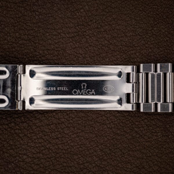 Omega folding clasp blade stamped STAINLESS STEEL, Omega logo and No.12 inside the oval