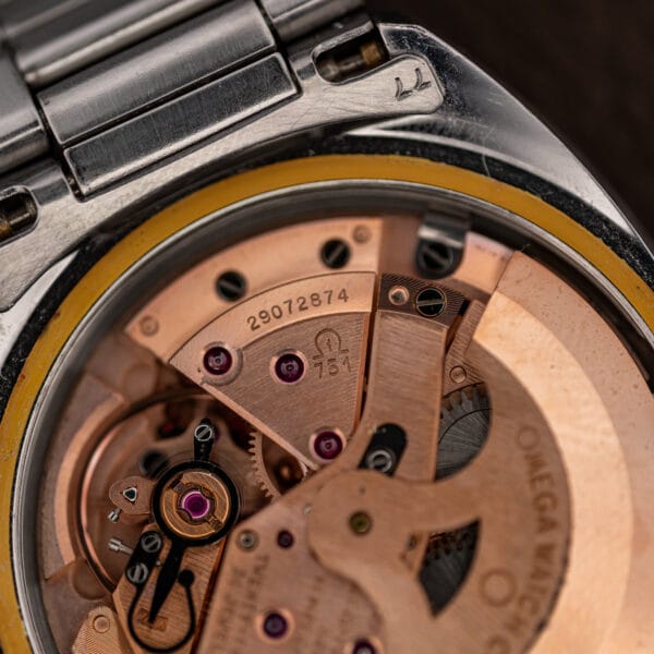 Macro of the Omega 751 bridge showing the caliber marking beneath the Omega symbol and serial 29072874
