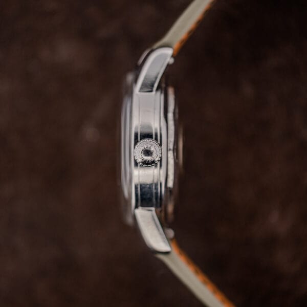 Crown-side profile of the Longines Conquest showing the large knurled steel crown at three o'clock