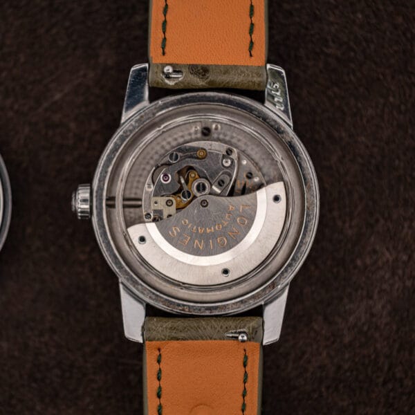 Automatic 19ASD movement seated in the case, signed rotor visible with corrosion along the inner rim