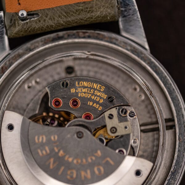 Movement bridge engraved Longines, 19 Jewels Swiss, serial 10074139 and calibre 19ASD above the signed rotor