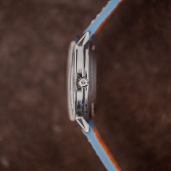 Profile of the Longines Admiral case from the crown side showing slim mid case and sharply downturned faceted lugs