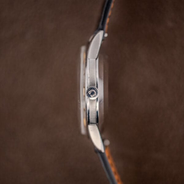 Omega-signed crown on the Omega 2982-3 SC at three o'clock, with slim polished mid case in profile